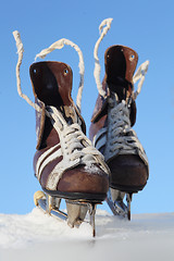 Image showing vintage pair of mens  skates on the ice