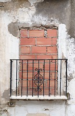 Image showing Old balcony door blocked by brick wall