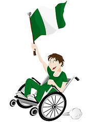 Image showing Nigeria Sport Fan Supporter on Wheelchair with Flag