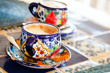 Image showing Cappuccino served in colorful cups