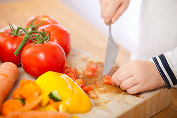 Image showing Child making salad