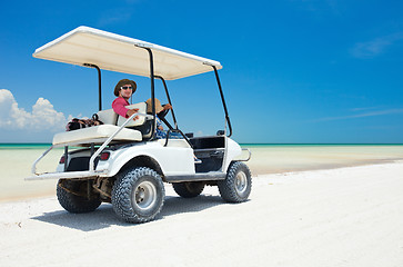 Image showing Golf cart at tropical beach