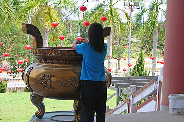 Image showing Girl praying in Chinese temple