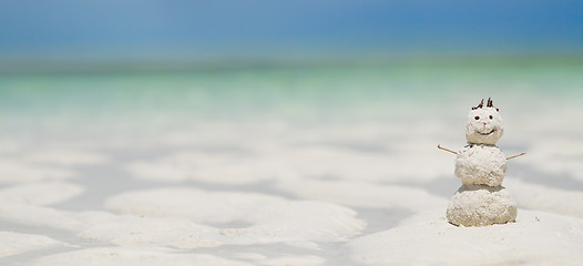 Image showing Snowman made from sand on beach