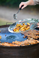 Image showing Chef cooking for a group