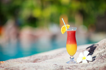 Image showing Tropical cocktail and frangipani flower