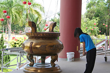 Image showing Girl praying in Chinese temple