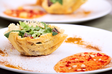 Image showing Fresh light salad in parmesan cheese basket