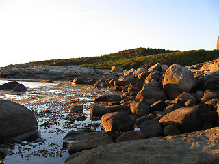 Image showing Rocky bay at sunset 2