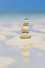 Image showing Snowman made from sand on beach