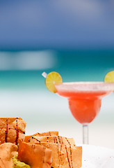 Image showing Tortilla chips and strawberry margarita cocktail