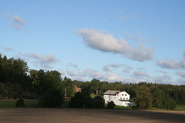 Image showing Country view with white building