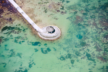 Image showing Above view of long jetty in ocean