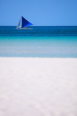 Image showing White sand beach and boat