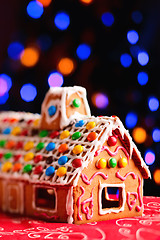 Image showing Gingerbread house beautifully decorated with candies