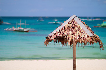 Image showing Straw beach umbrella