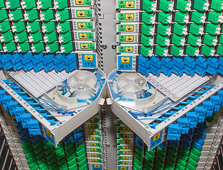 Image showing fiber optic rack with high density of blue and green SC connectors