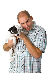 Image showing Young man and his puppy