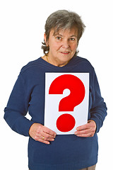 Image showing Female senior holding question mark