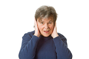 Image showing Senior woman holding her ears