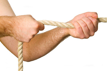 Image showing Hands pull a rope