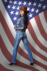 Image showing Young woman in jeans with American flag