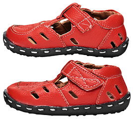 Image showing Kids red leather sandals on white