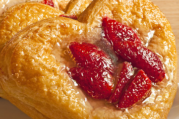 Image showing flaky pastry heart with strawberries