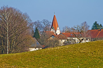 Image showing  panoramic view to a small village with a church