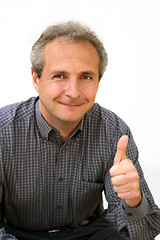 Image showing Happy businessman thumbs up