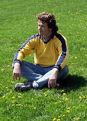 Image showing Man sitting on grass