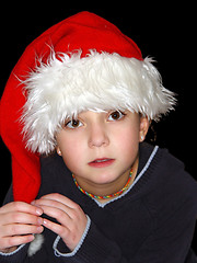 Image showing Cute girl in a Christmas hat