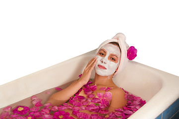 Image showing beautiful woman enjoying floral bath