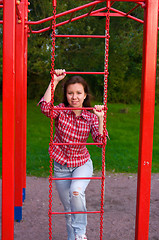 Image showing happy young woman on playground