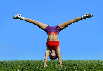 Image showing Girl exercising outdoors