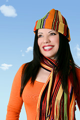 Image showing Cheerful woman in winter scarf and hat