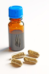 Image showing tincture and pills