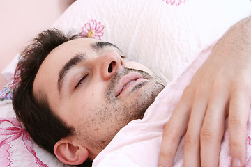 Image showing Young man sleeping .