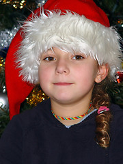 Image showing Cute girl in a Christmas hat