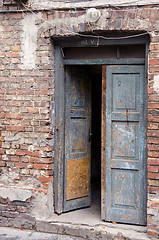 Image showing grunge masonry house doors brick wall background 