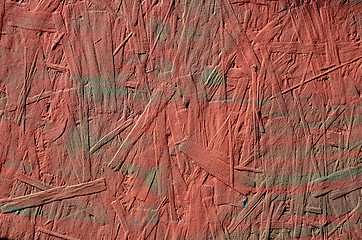 Image showing grunge red painted chipboard closeup background 