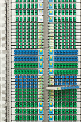 Image showing fiber optic rack with high density of blue and green SC connectors