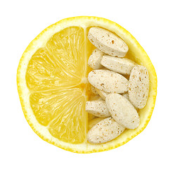 Image showing Close up of lemon and pills isolated – vitamin concept - vitamin c