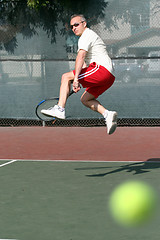 Image showing Middleage man playing tennis