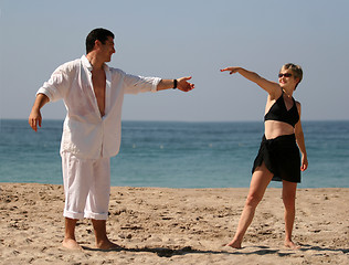 Image showing Young couple dancing on the beach