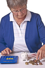 Image showing pensioneer counting her retirement pay