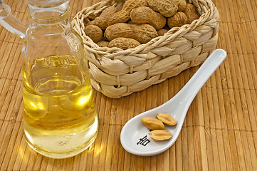 Image showing peanut oil with peanuts
