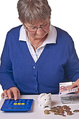 Image showing pensioneer counting her retirement pay