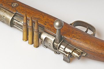 Image showing carbine with ammunition