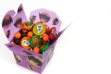 Image showing Halloween candy in purple chinese container